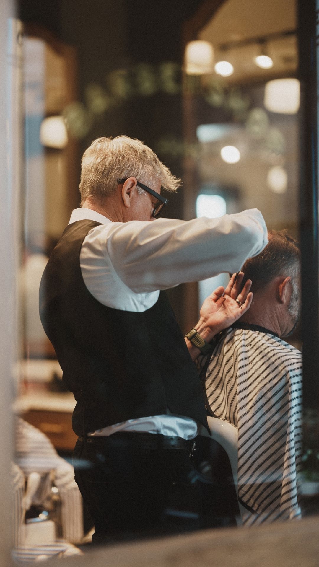 Students learning barbering